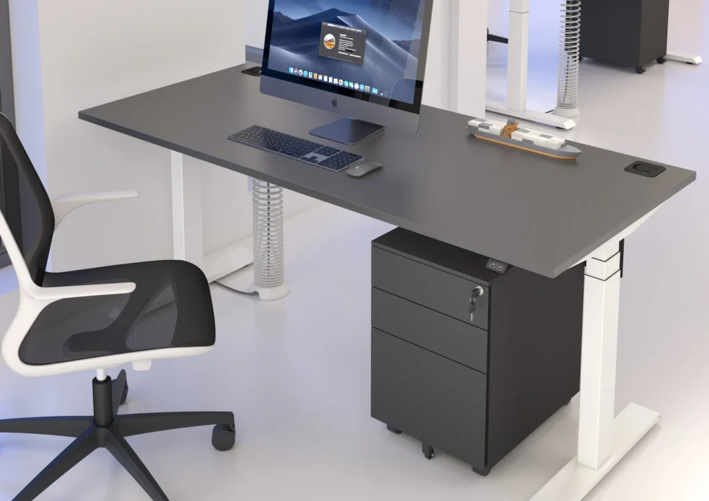 A computer desk featuring a monitor and keyboard, set up for work or study purposes.